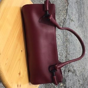 Authentic Gucci shoulder bag with horse bit detailing.